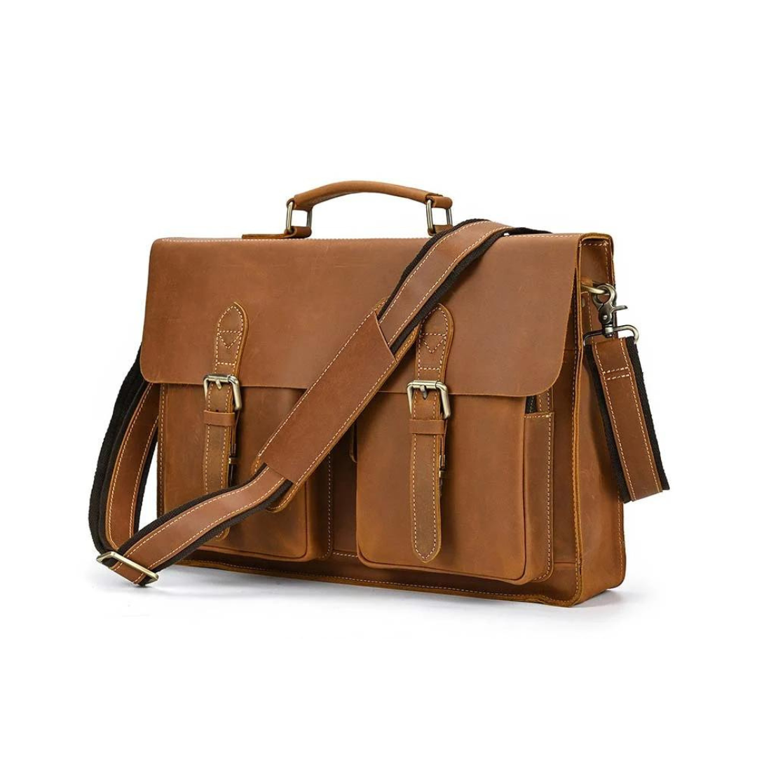 Handmade vintage design satchel made with selected genuine cow leather. The leather is very thick and top quality. It can be carried as a everyday bag for men perfectly. The bag can be fit 14''-15'' inches laptop, also there are many pockets inside and outside of the bag, which makes it very suited for storage and organization.