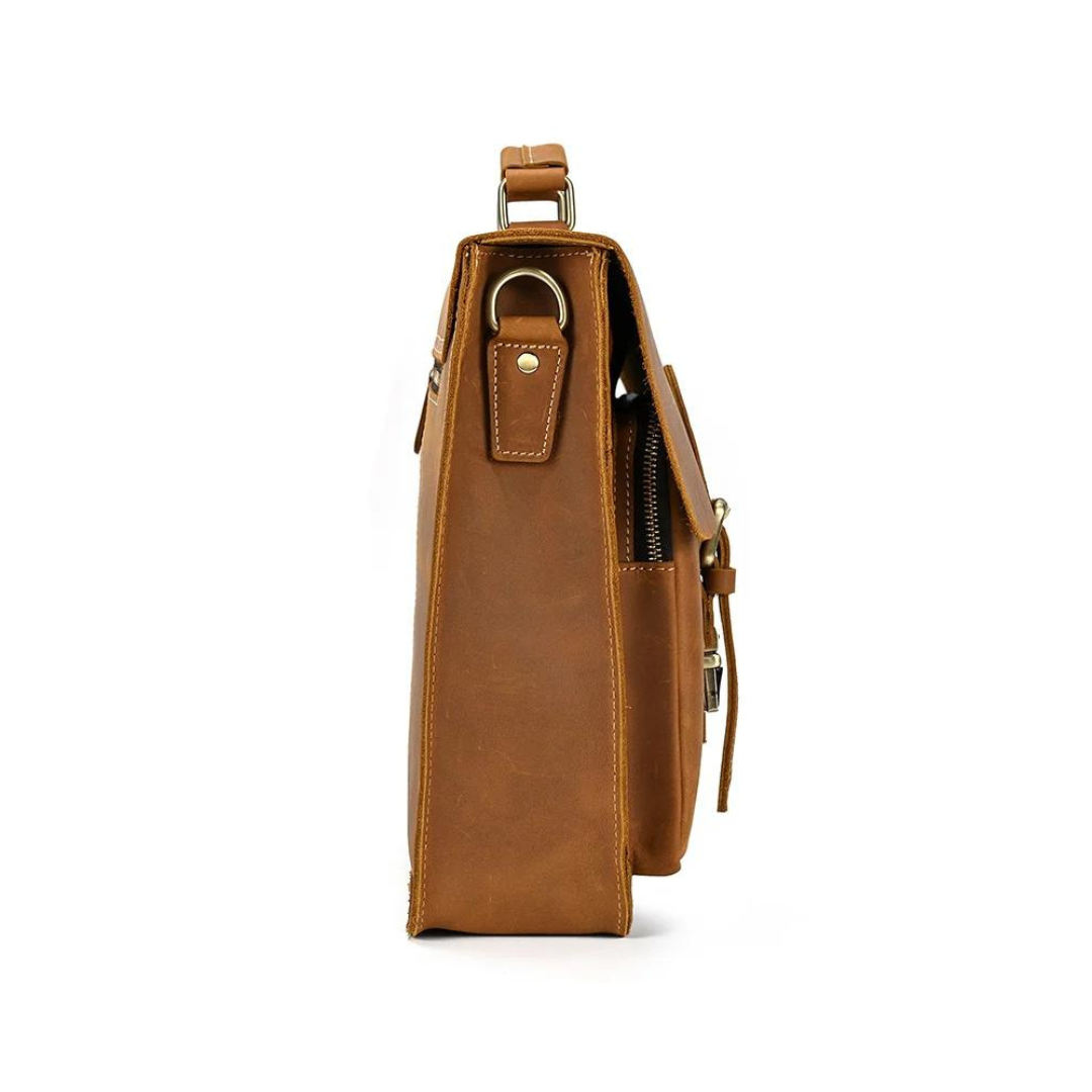 Handmade vintage design satchel made with selected genuine cow leather. The leather is very thick and top quality. It can be carried as a everyday bag for men perfectly. The bag can be fit 14''-15'' inches laptop, also there are many pockets inside and outside of the bag, which makes it very suited for storage and organization.