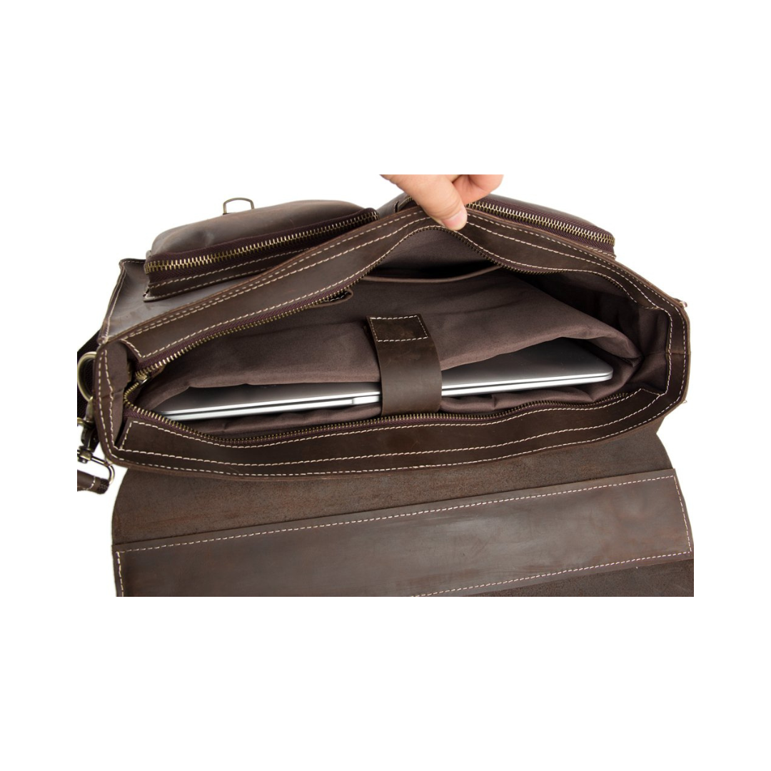 Handmade vintage design satchel made with selected genuine cow leather. The leather is very thick and top quality. It can be carried as a everyday bag for men perfectly. The bag can be fit 14''-15'' inches laptop, also there are many pockets inside and outside of the bag, which makes it very suited for storage and organization.